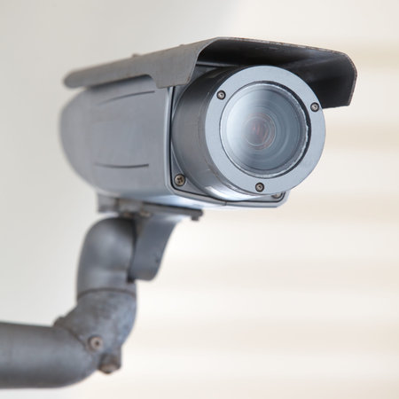 video camera security system on the wall of the building