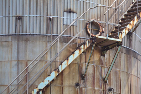 close - up Old oil tank in industrial zoneの写真素材
