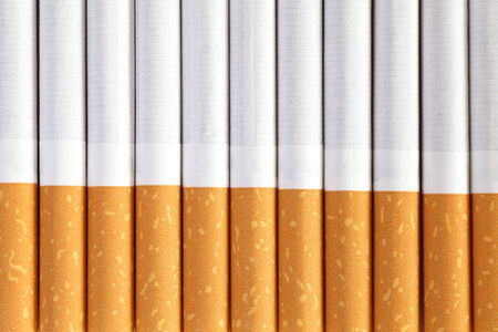 Cigarettes with a brown filter close - upの写真素材