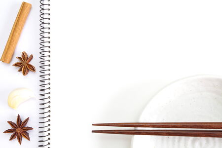 Open white notebook with ingredients for recipesの写真素材