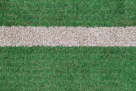 Green grass and White strip in the field for footballの写真素材