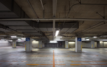 Parking garage  interior, neon lights in darkのeditorial素材