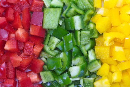 Close - up fresh colorful bell peppers choppedの写真素材