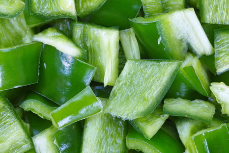 Close - up fresh green bell peppers choppedの写真素材