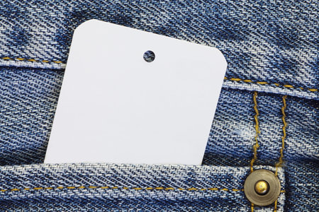 white blank paper tag price on blue jean