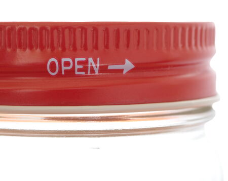 Close - up Red lid open at glass bottleの写真素材