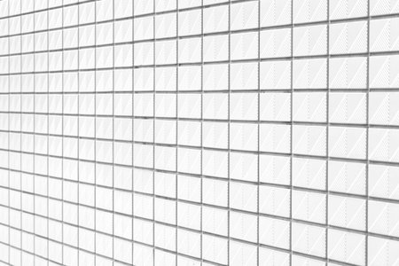 The modern white concrete tile wall backgroundの写真素材