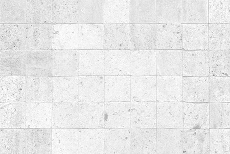 The modern white concrete tile wall backgroundの写真素材