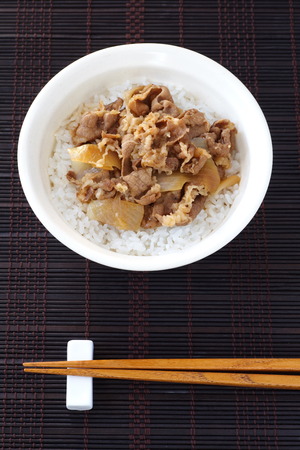 Beef bowl , Japanese dish consisting of a bowl of rice topped with beef and onionの写真素材