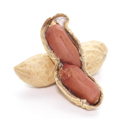 Close - up Raw dried peanut on white background
