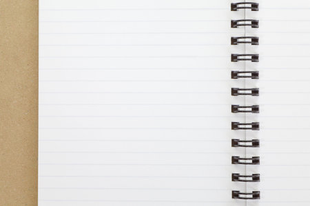 Open blank notebook on brown wooden table