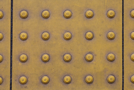 Yellow tactile strip for cane or foot of blind personの写真素材