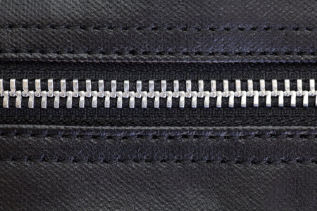 Close - up of zip on black leather bagの写真素材