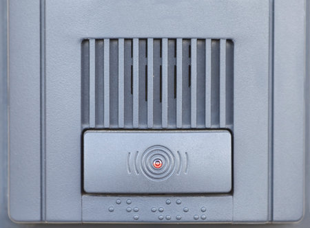 Close - up at Security intercom button in the apartment door
