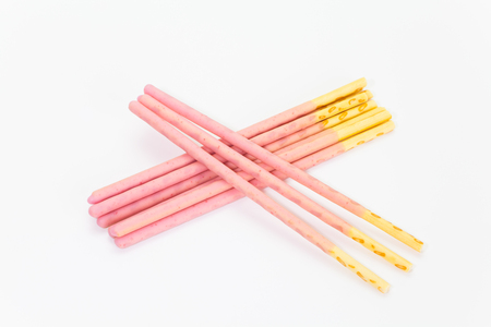 Japanese snack food biscuit stick strawburry coated on white backgroundの写真素材