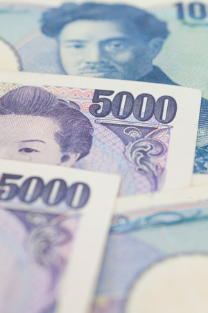 Stack of japanese currency yen or Japanese banknotesの写真素材