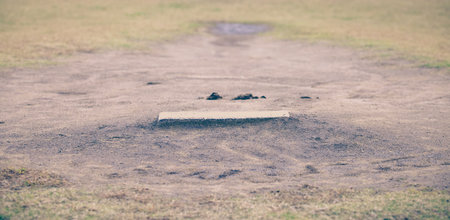 Close - up Baseball Pitching mound and green grassの写真素材