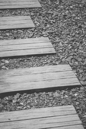 Stone block pathway and black pebble at gardenの写真素材
