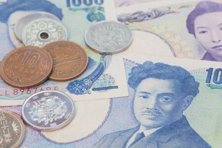 Close - up Japanese yen banknotes and Japanese yen coinの写真素材