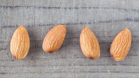 Close - up Almond on wood table backgroundの写真素材