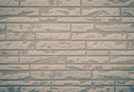 Brown brick stone wall seamless background and texture