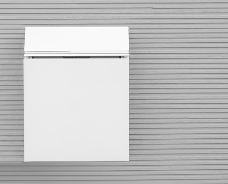 Metal post box and modern concrete wall backgroundの写真素材