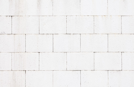 The modern white concrete tile wall background and textureの写真素材