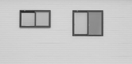 Detail of house exterior wall and window.の写真素材