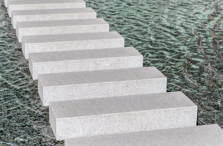 Modern concrete block pathway in water poolの写真素材