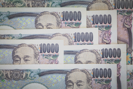 Stack of japanese currency yen or Japanese banknotesの写真素材