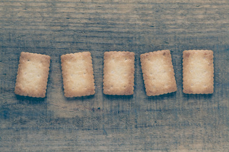 Piece of Mini coconut biscuit on wood table background