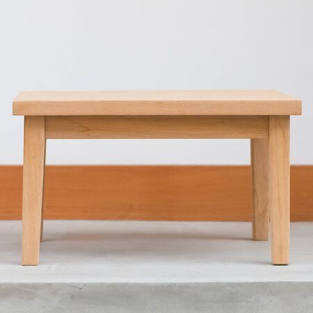 Simple brown wood table and white concrete wallの写真素材