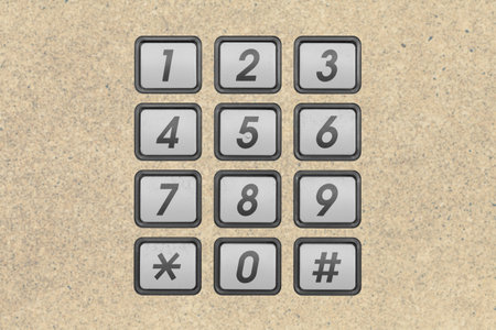 Metal phone number keypad on blurred background