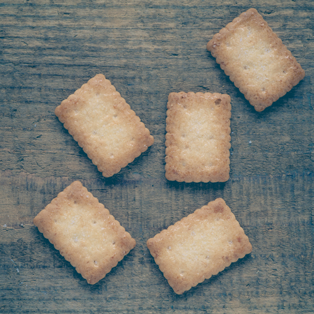 Piece of Mini coconut biscuit on wood table backgroundの写真素材
