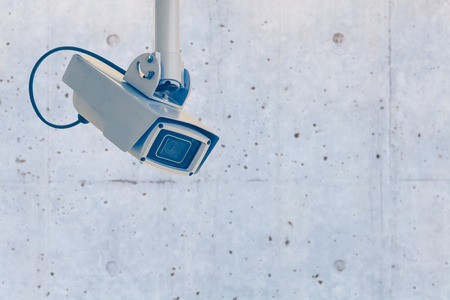 Video camera security system on the wall of the buildingの写真素材