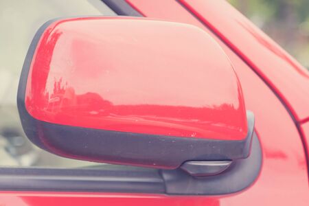 luxury car closed wing mirror after parking for safty driveの写真素材