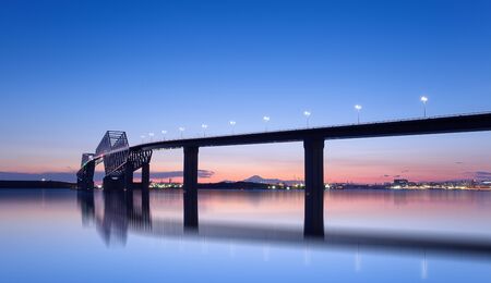 Beautiful Tokyo sunset at Tokyo gate bridge and Mountain Fuji in backgroundの写真素材