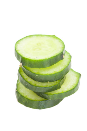 Fresh cucumber slice isolated on white backgroundの写真素材