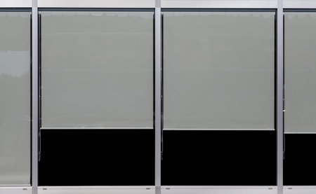 Window glass frame and plastic window blind at building wall