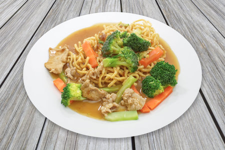 Chinese food , Crispy fried egg noodle with pork and carrot , broccoli vegetableの写真素材
