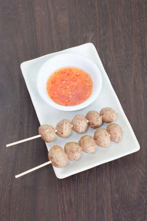 Grilled pork meat ball and sweet chili sauceの写真素材