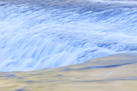 Fast and flowing waterfall  background , long exposureの写真素材