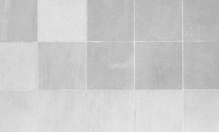 The modern white concrete tile wall background and textureの写真素材