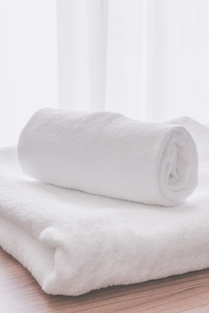 Clean white towel fold in hotel roomの写真素材