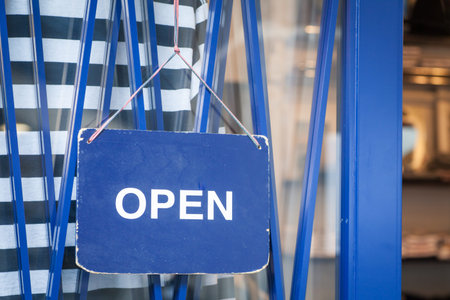 Wood open sign boaed hang on shop wood door