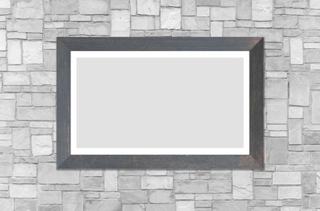Wooden picture frame on brick wall backgroundの写真素材
