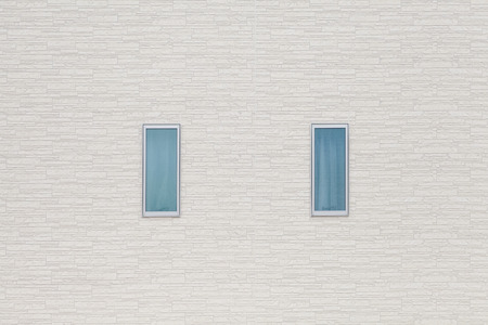 Detail of house exterior wall and window.の写真素材