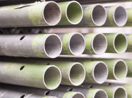 Close - up Stack of construction metal pipesの写真素材