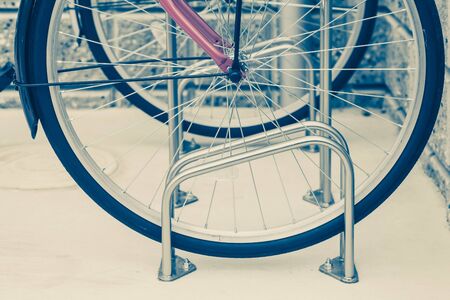 Locked bicycle at bicycle outdoor parking spaceの写真素材