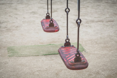Close - up Empty swings kid at outdoor playgroundの写真素材